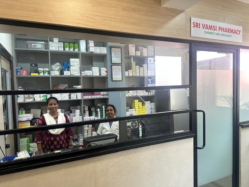 Sri Vamsi Pharmacy counter with staff